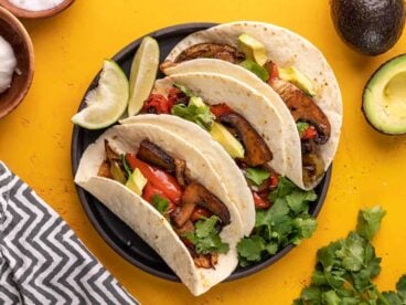 Three portobello fajitas on a plate.