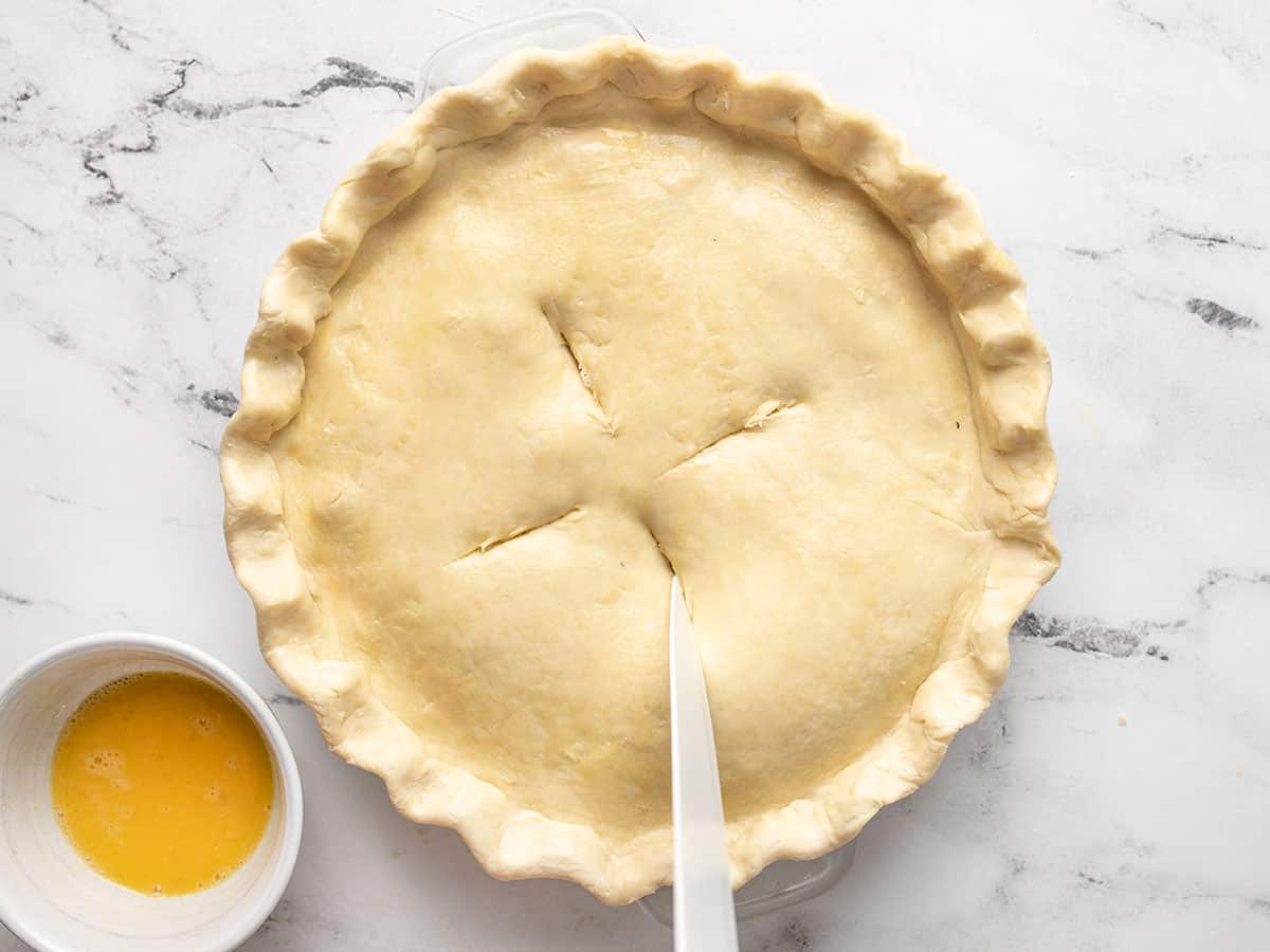 Vents being cut into the top pie crust.