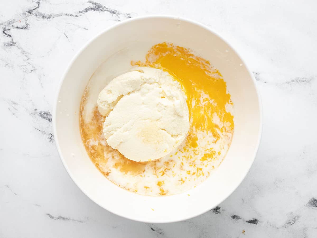 Overhead shot of wet ingredients in a white bowl.