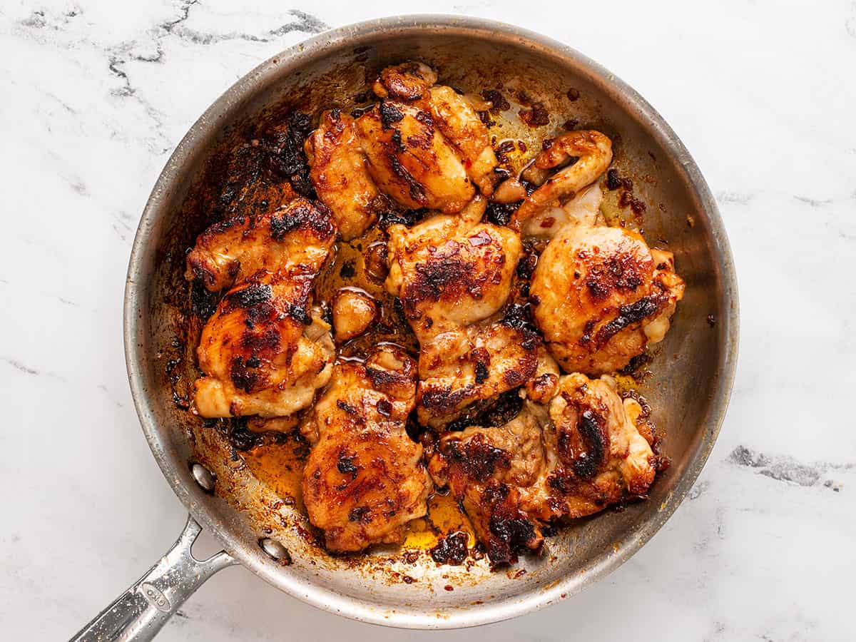 Finished honey chipotle chicken thighs in the skillet. 