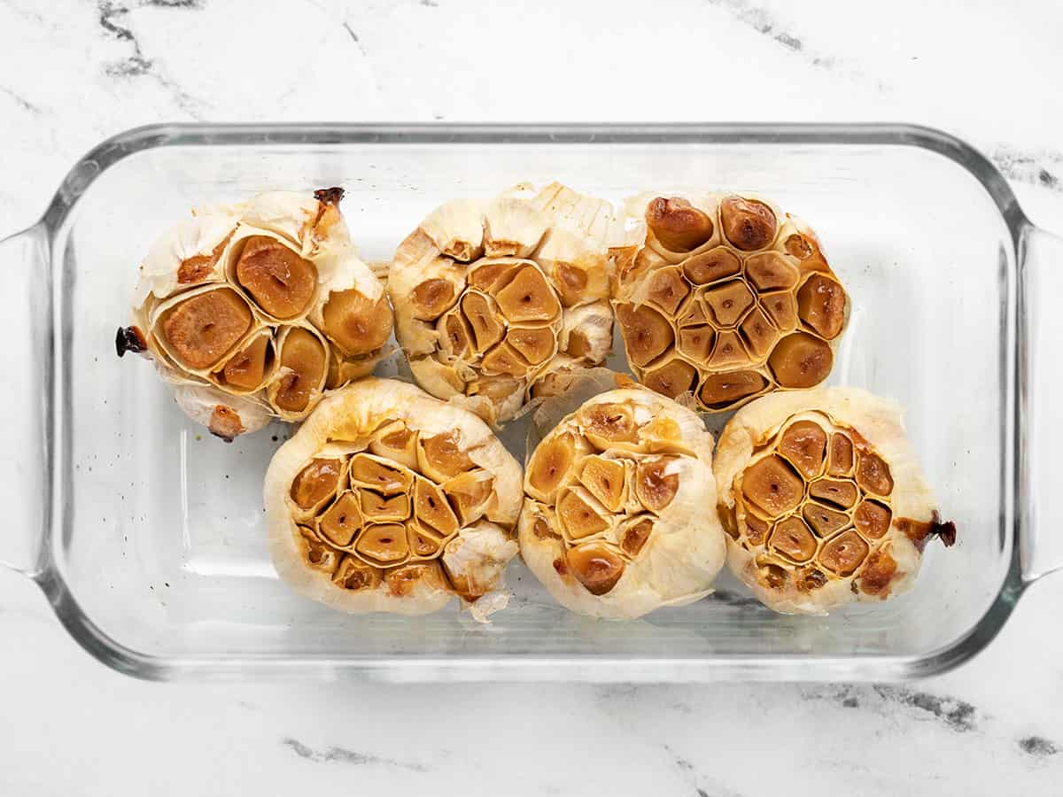 Roasted garlic in the baking dish with foil removed.