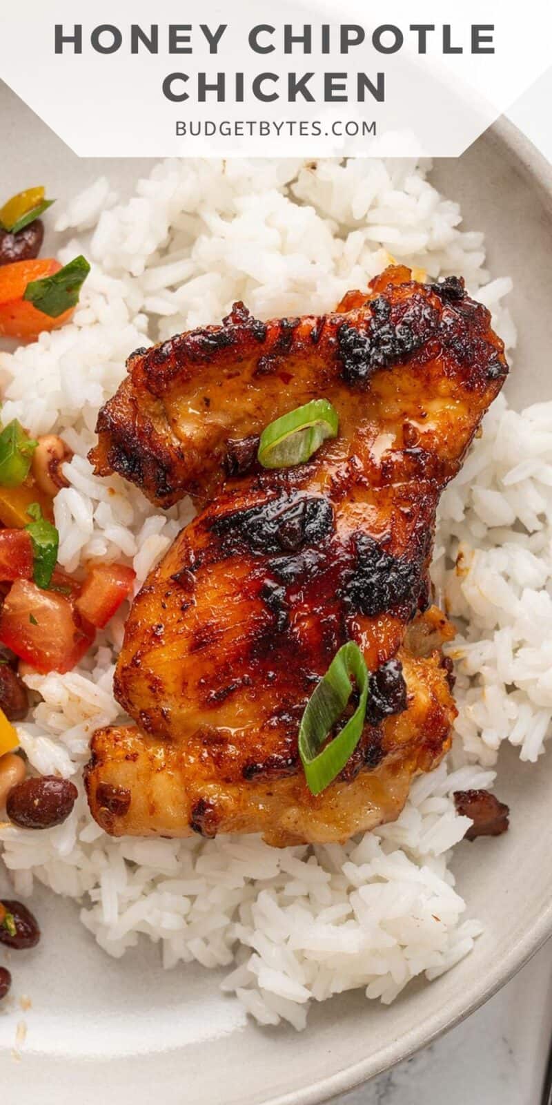 One honey chipotle chicken thigh on a bed of rice with title text at the top.