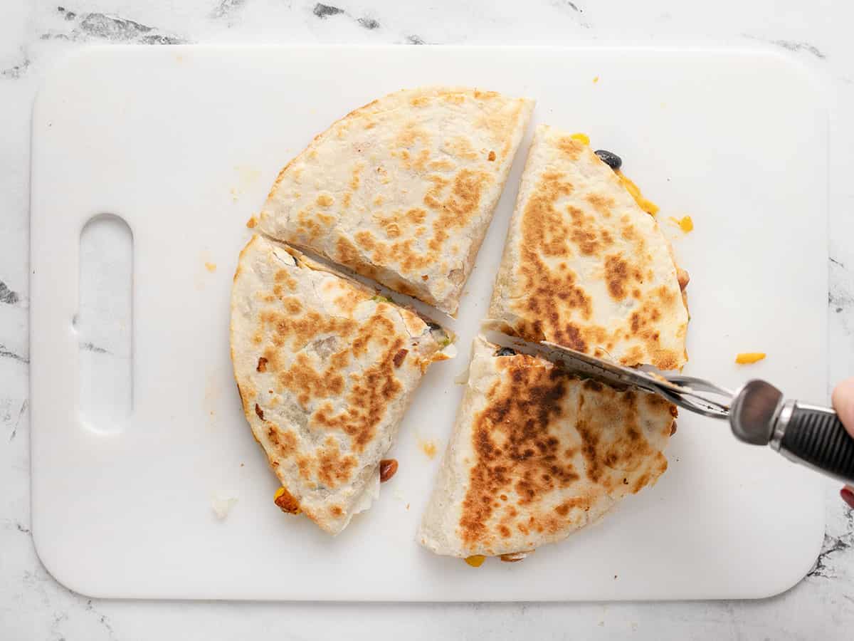 Quesadillas being sliced.