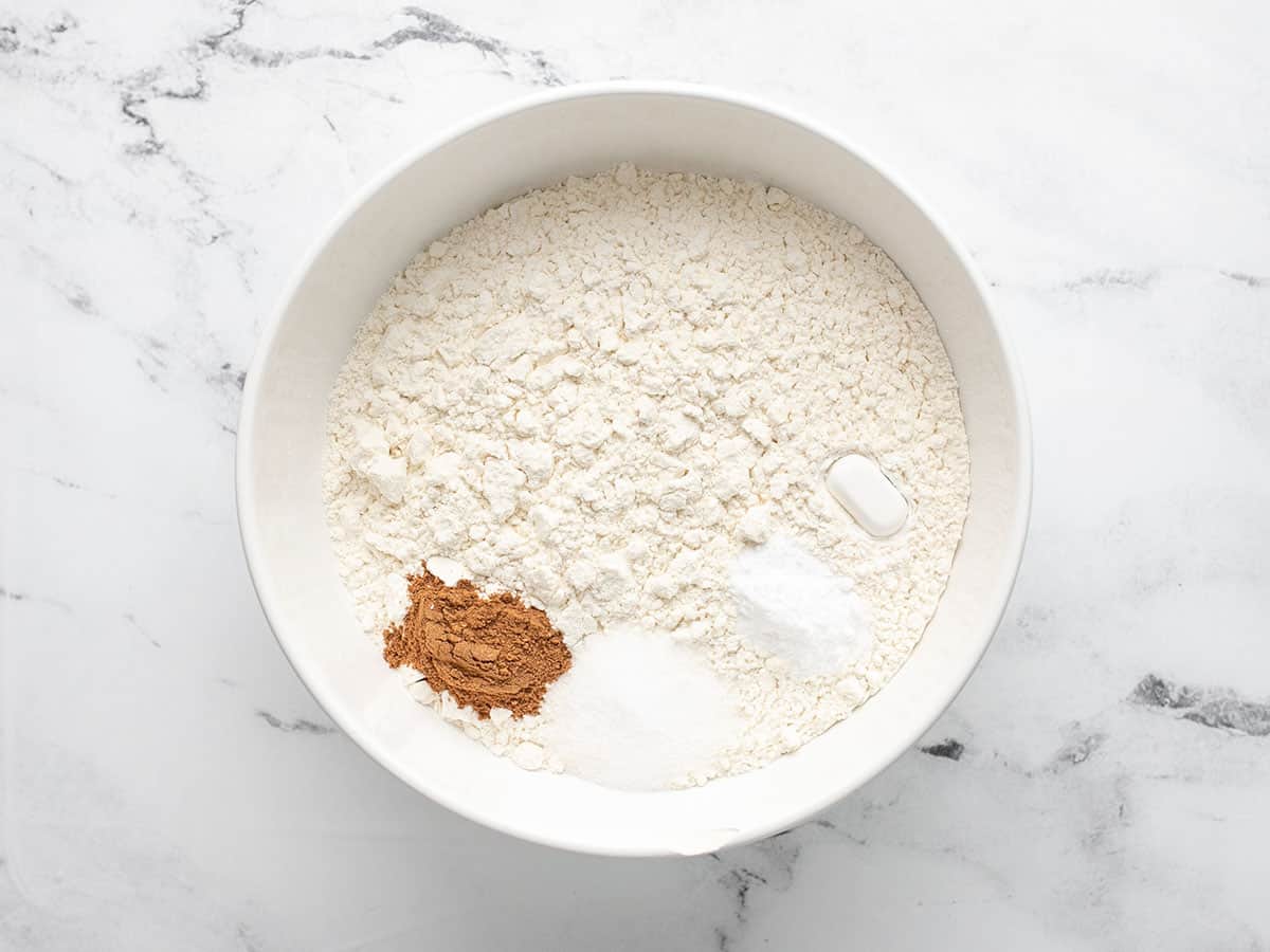 Overhead shot of dry ingredients in a white bowl.