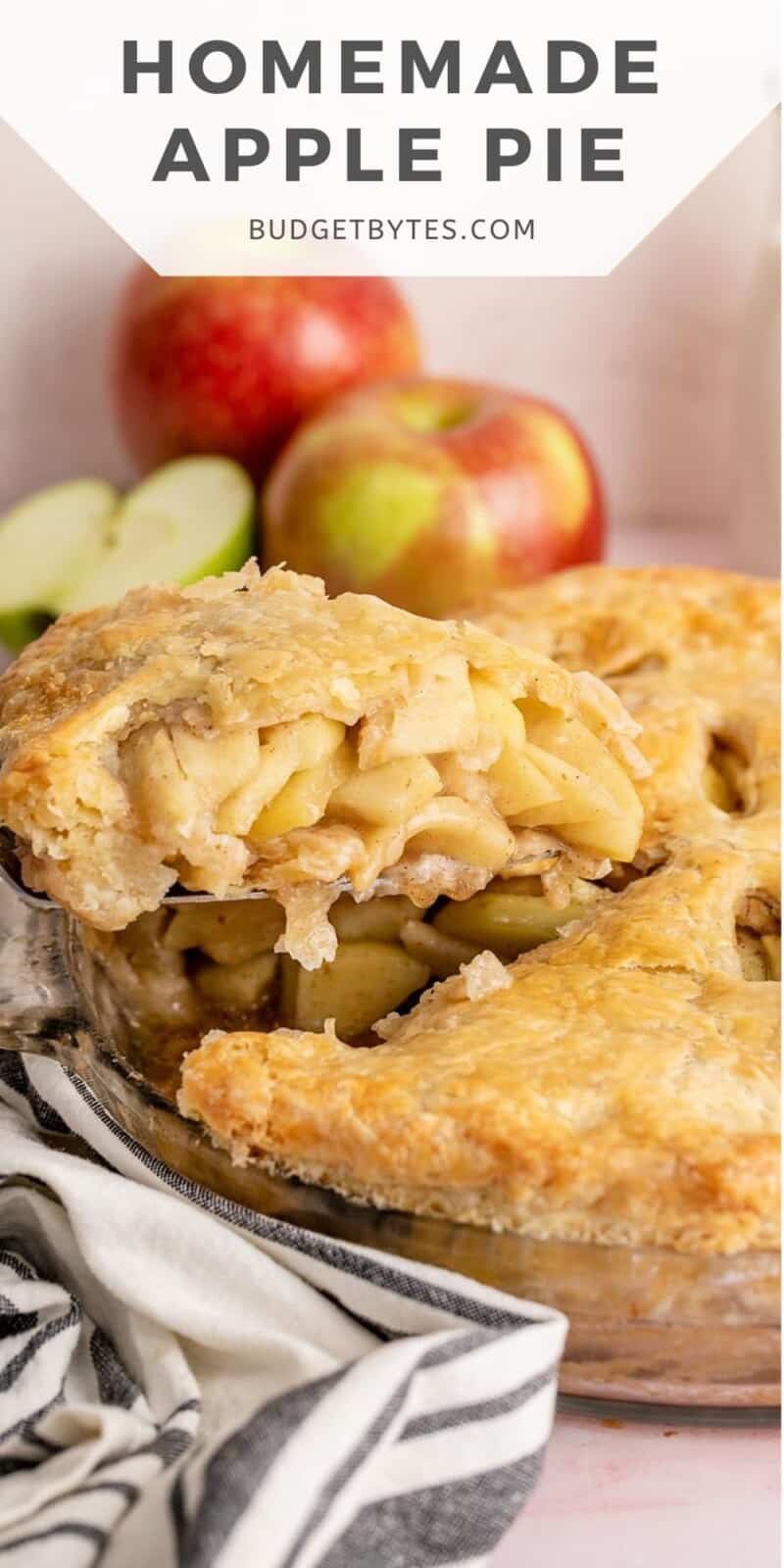 Side shot of a slice of apple pie being lifted out of a pie dish.