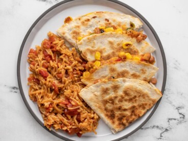 Plated quesadillas and Spanish rice.