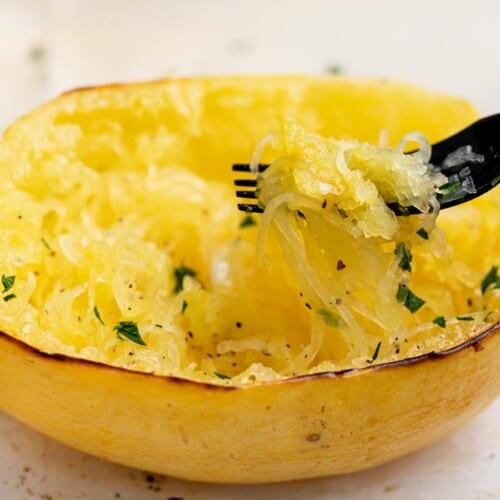 Roasted spaghetti squash on a plate.