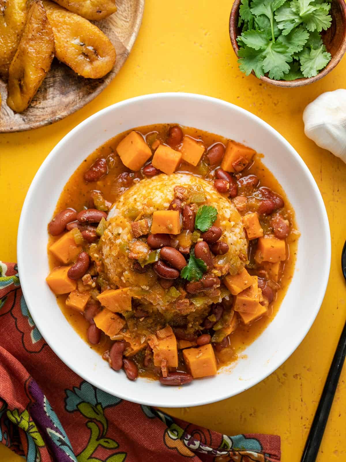 Overhead shot of a white bowl of red beans and rice.