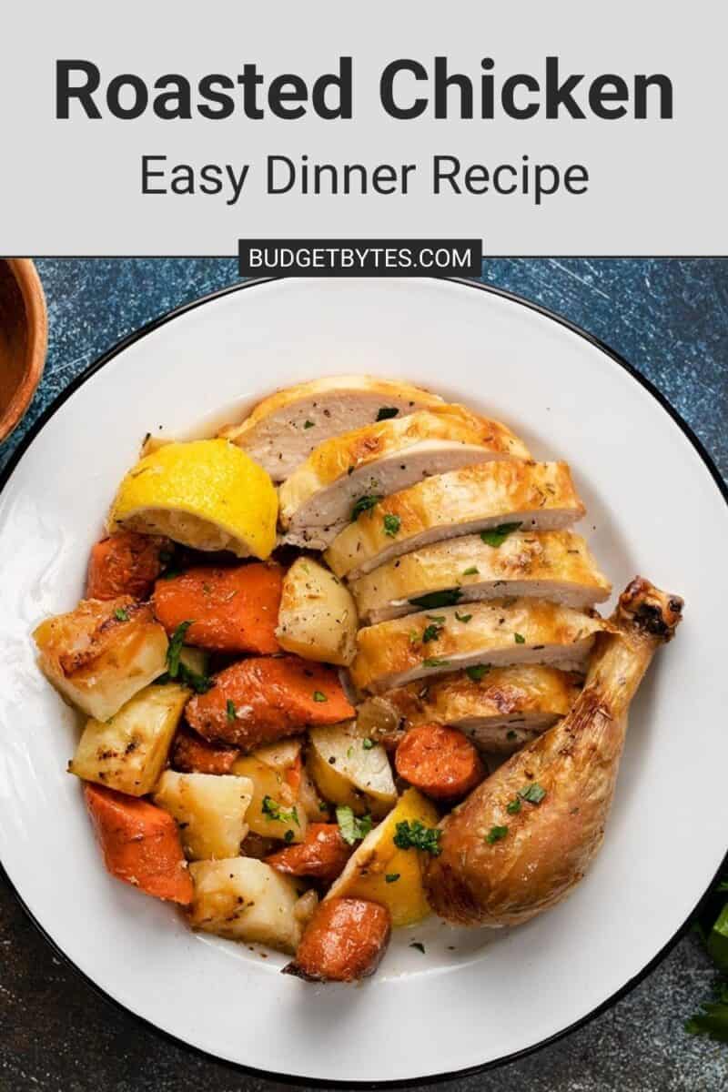 Overhead shot of sliced chicken and roasted vegetables on a white plate.