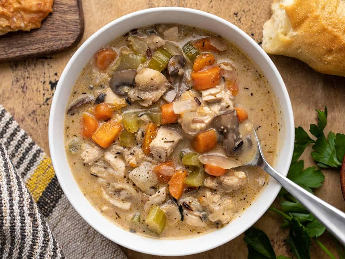 Overhead view of a bowl of turkey and wild rice soup.