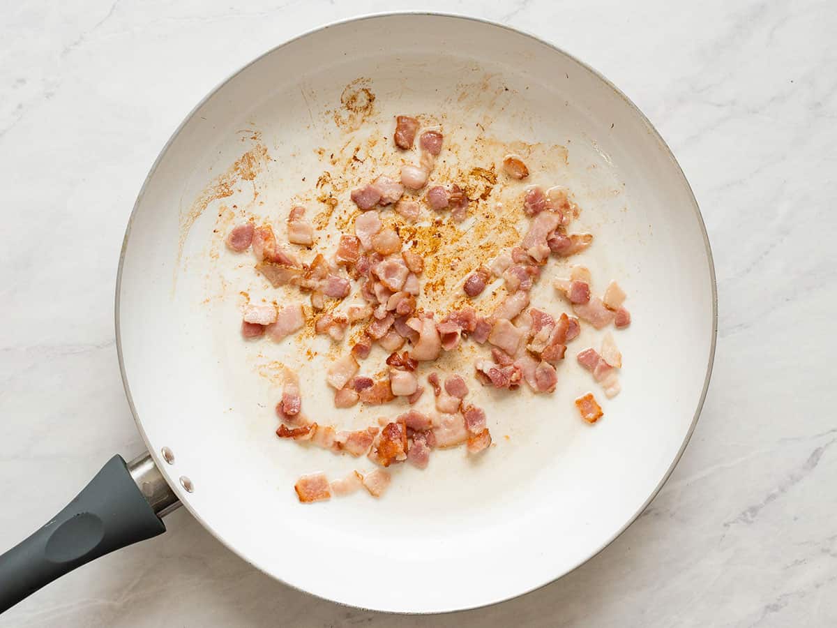 Cooked bacon in a skillet.