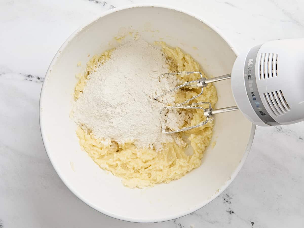 Flour added to creamed butter and sugar mixture.