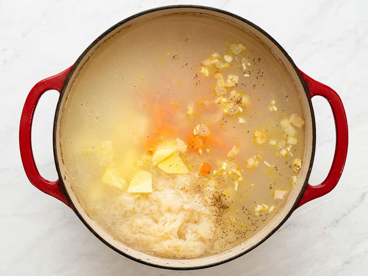 Vegetables added to the soup pot.