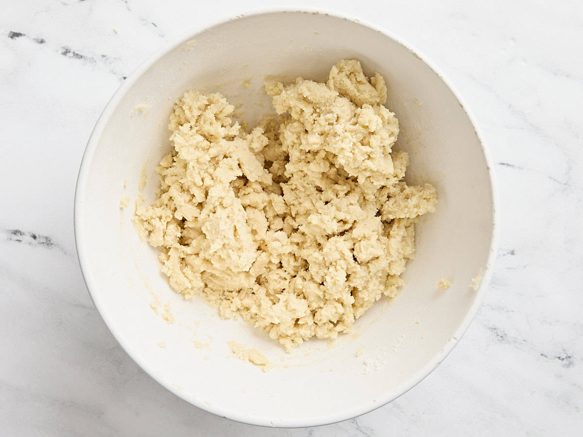 Sugar cookie dough in a mixing bowl.