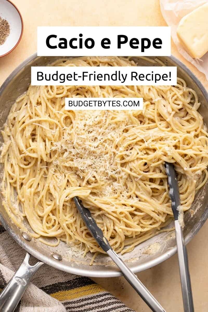 Overhead shot of finished Cacio e Pepe in a pan with tongs in it.