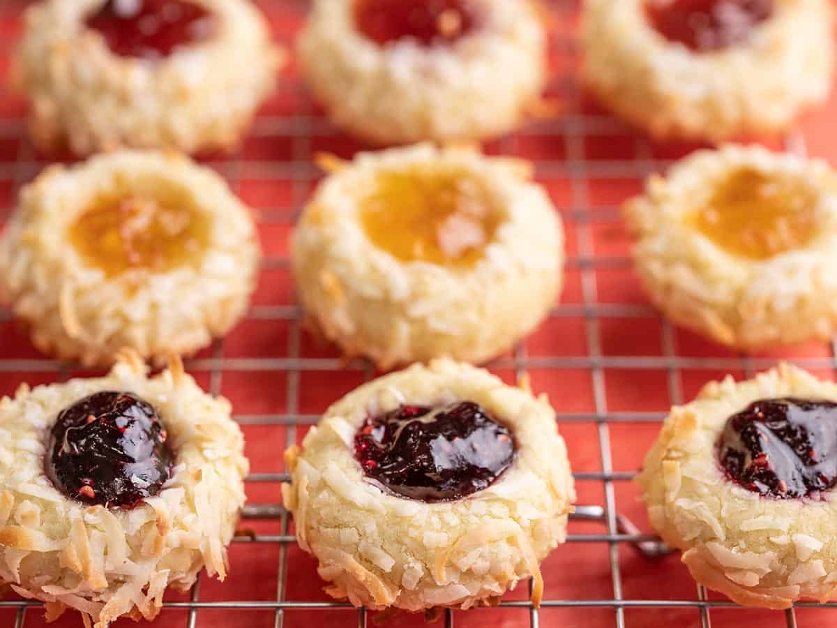 Side view of thumbprint cookies on a cooling rack.