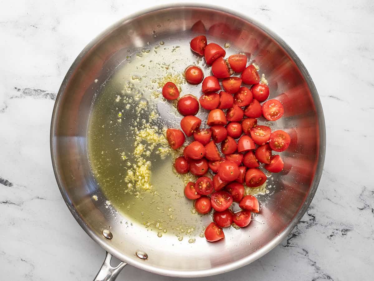 Tomatoes added to the skillet.