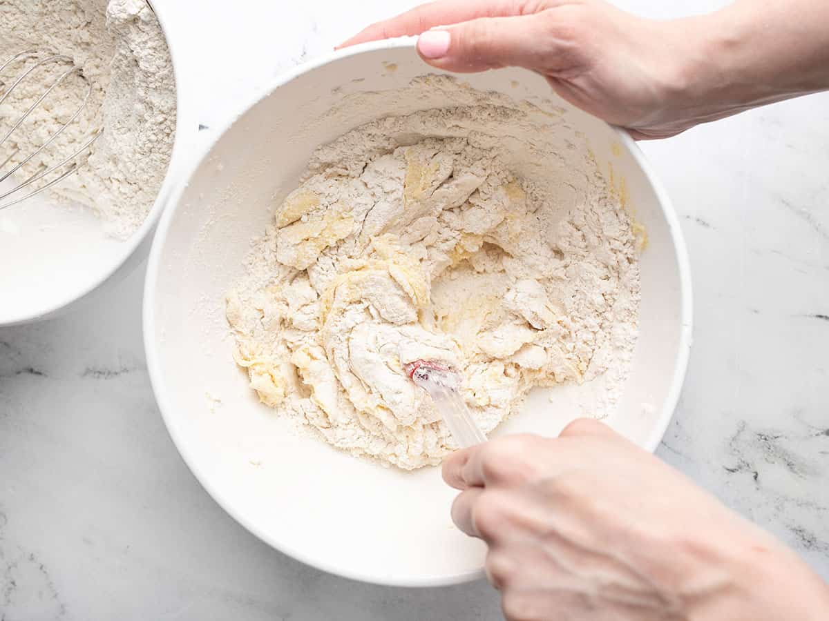 Dry ingredients being mixed into wet ingredients.