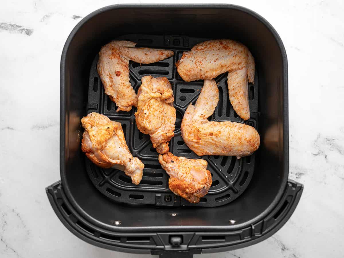 Overhead shot of air fryer chicken wings.halfway through the cook