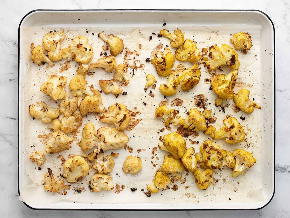 Roasted cauliflower on the sheet pan.