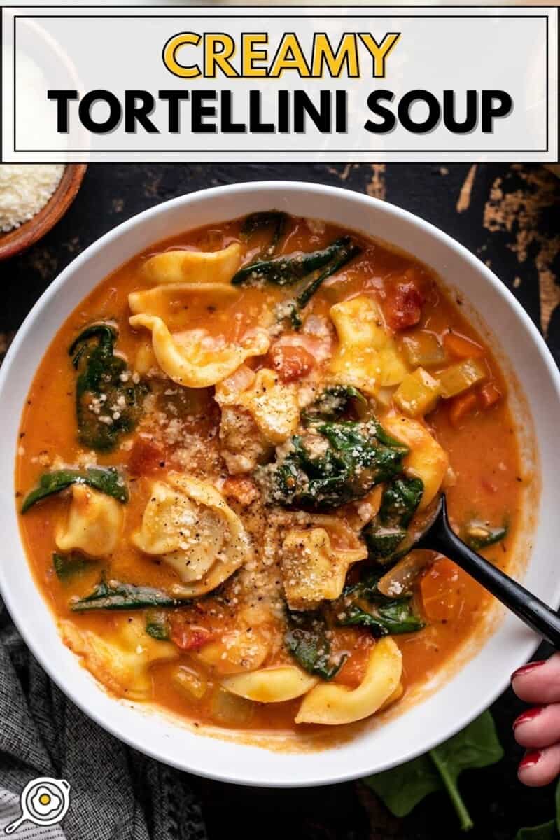 Overhead view of a bowl full of tortellini soup.