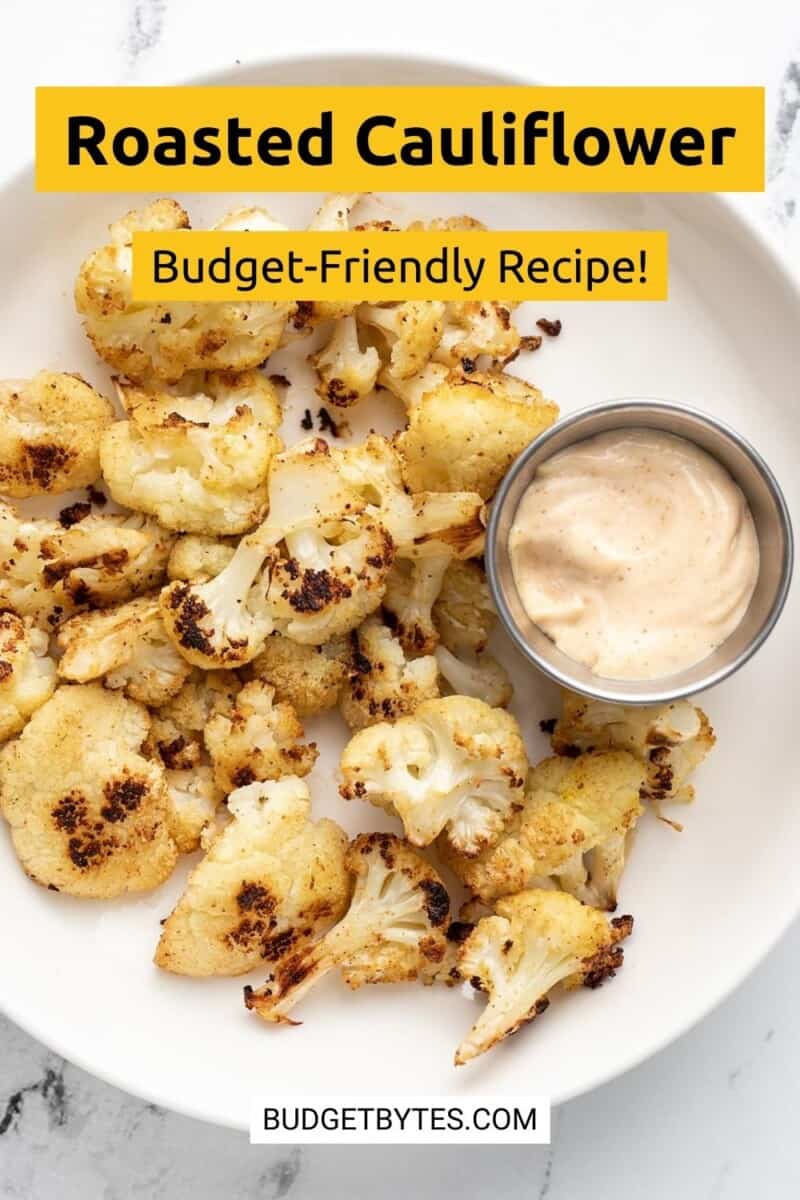 Overhead view of roasted cauliflower on a plate with dipping sauce.