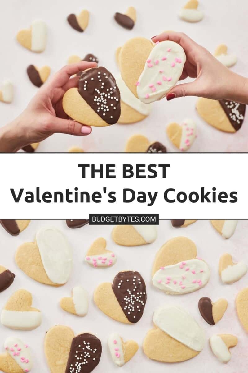 Overhead shot of two hands holding Valentine's Day cookies.