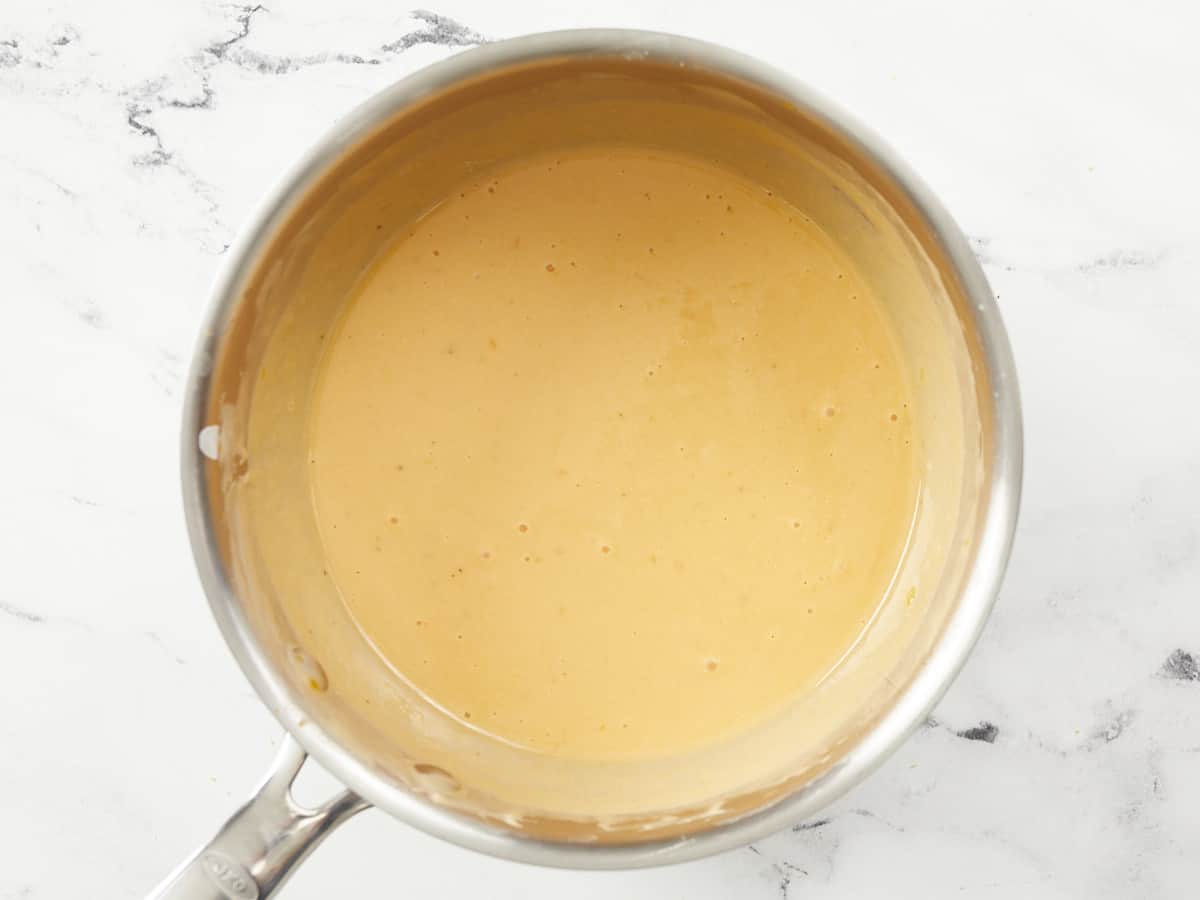 A small saucepot of finished beer cheese dip.