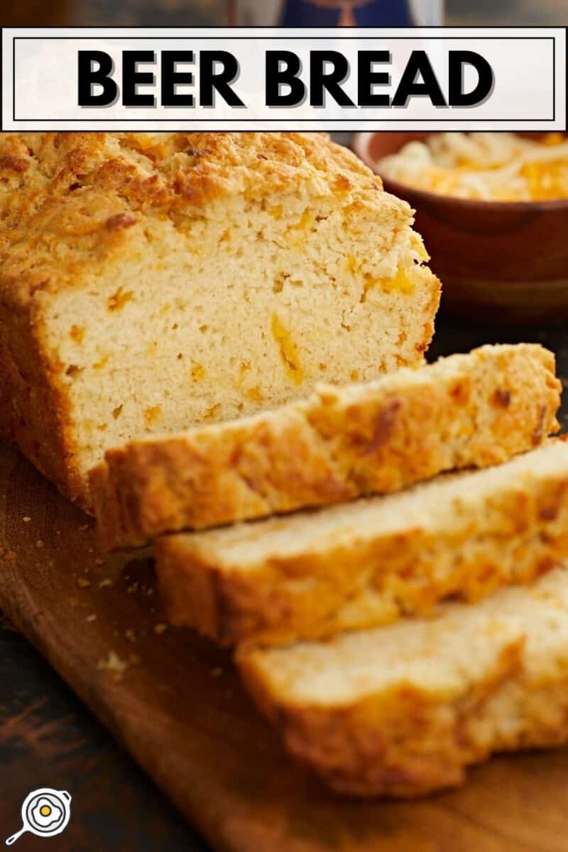 Front view of a sliced loaf of beer bread.