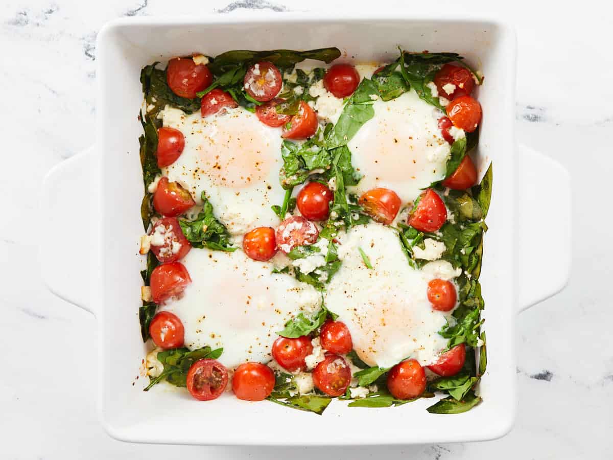 Finished baked eggs in the casserole dish.