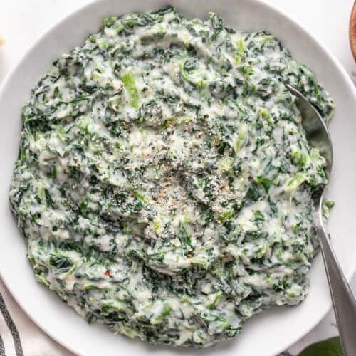 Overhead view of creamed spinach in a bowl.