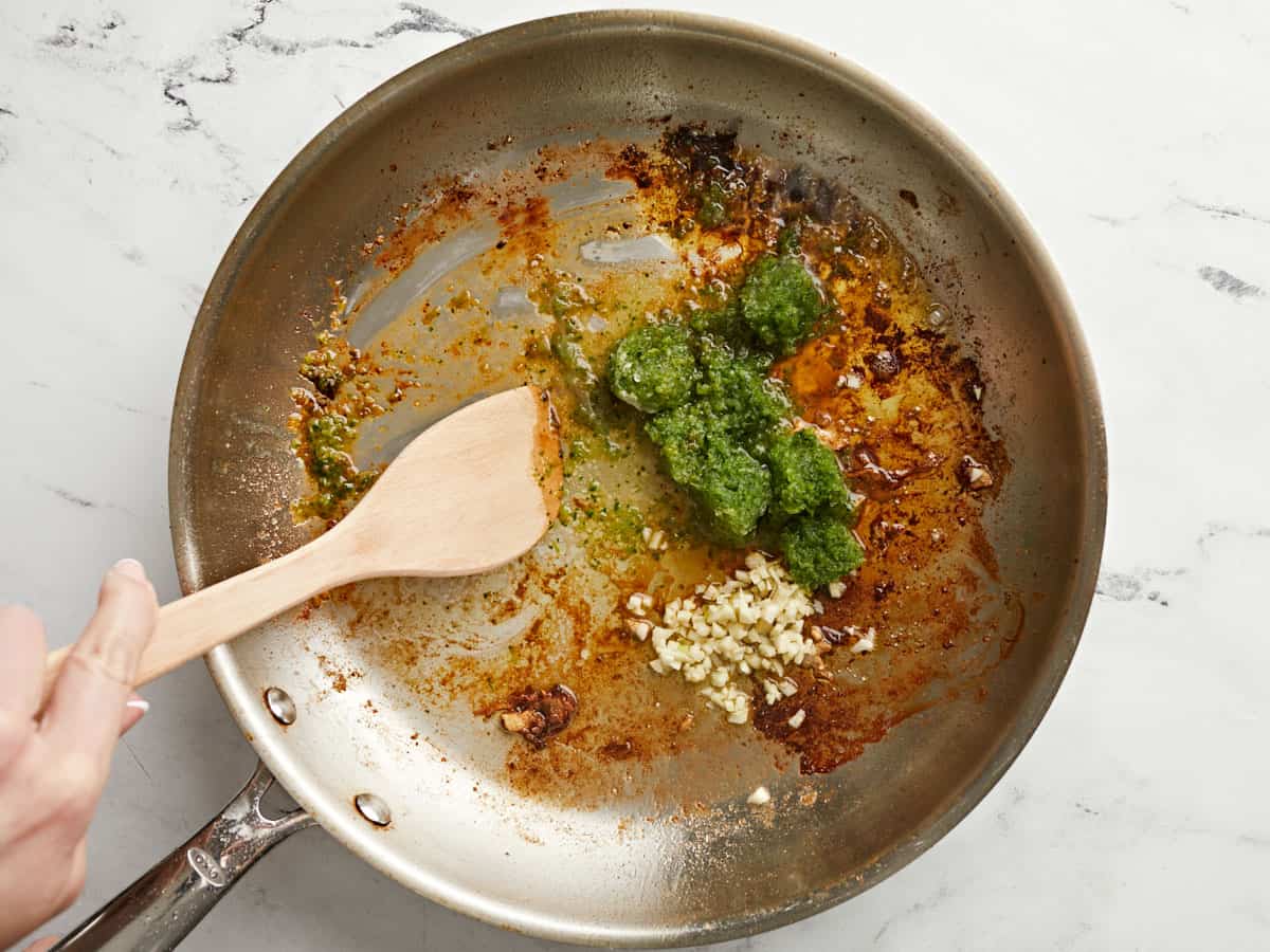 Sofrito and garlic added to the skillet.