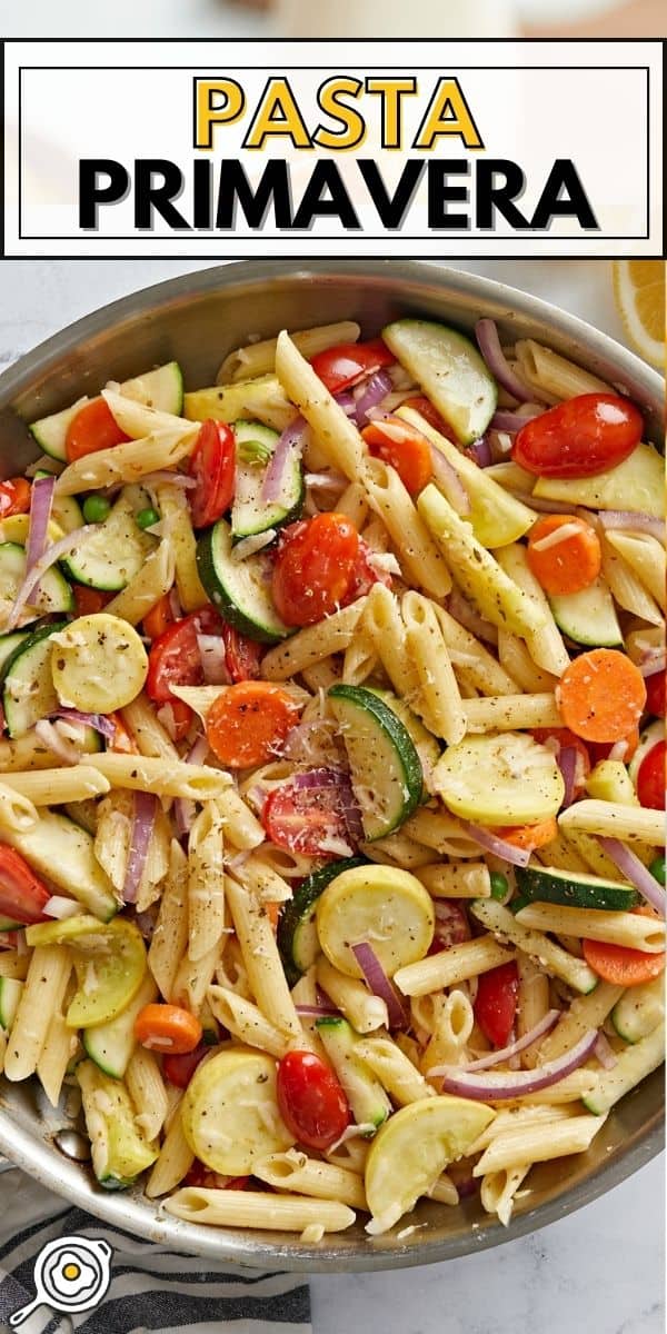 Overhead view of a skillet full of pasta primavera.