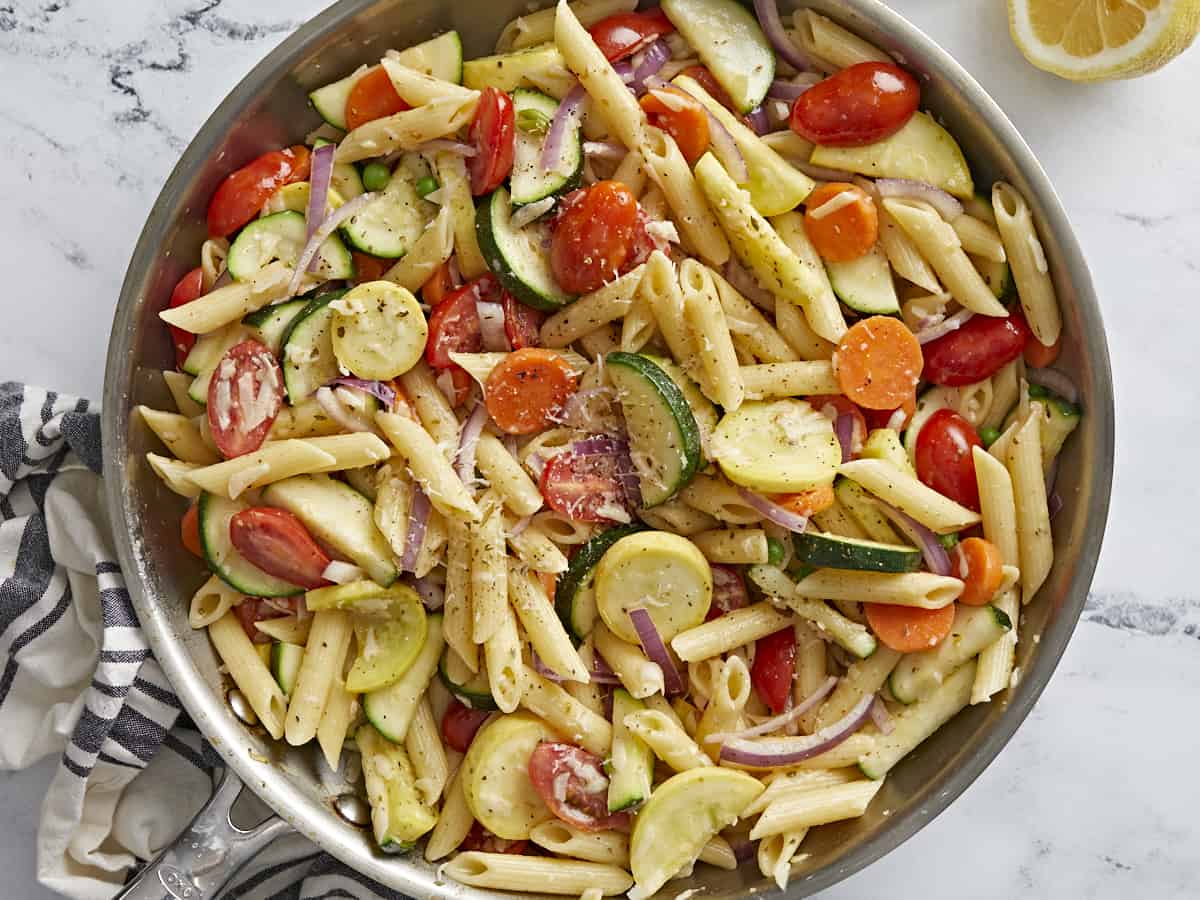 Overhead shot of pasta primavera in a skillet.