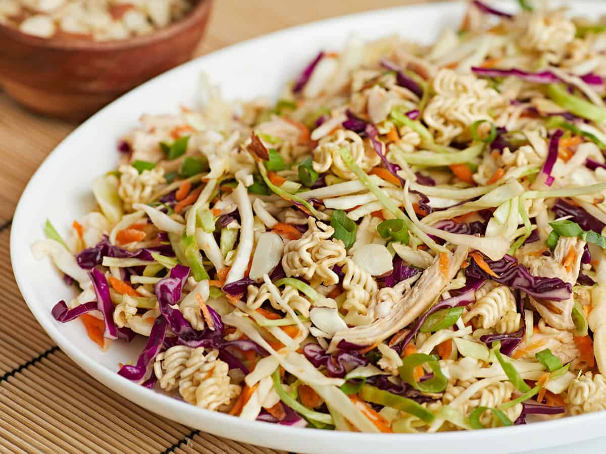 Close up side view of ramen noodle salad in a serving platter. 