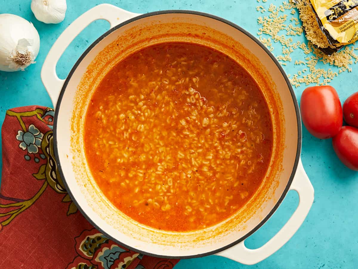 Overhead view of a pot full of sopa de letras. 