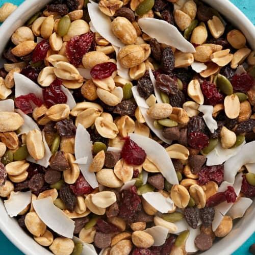 Overhead close up view of a bowl full of trail mix.