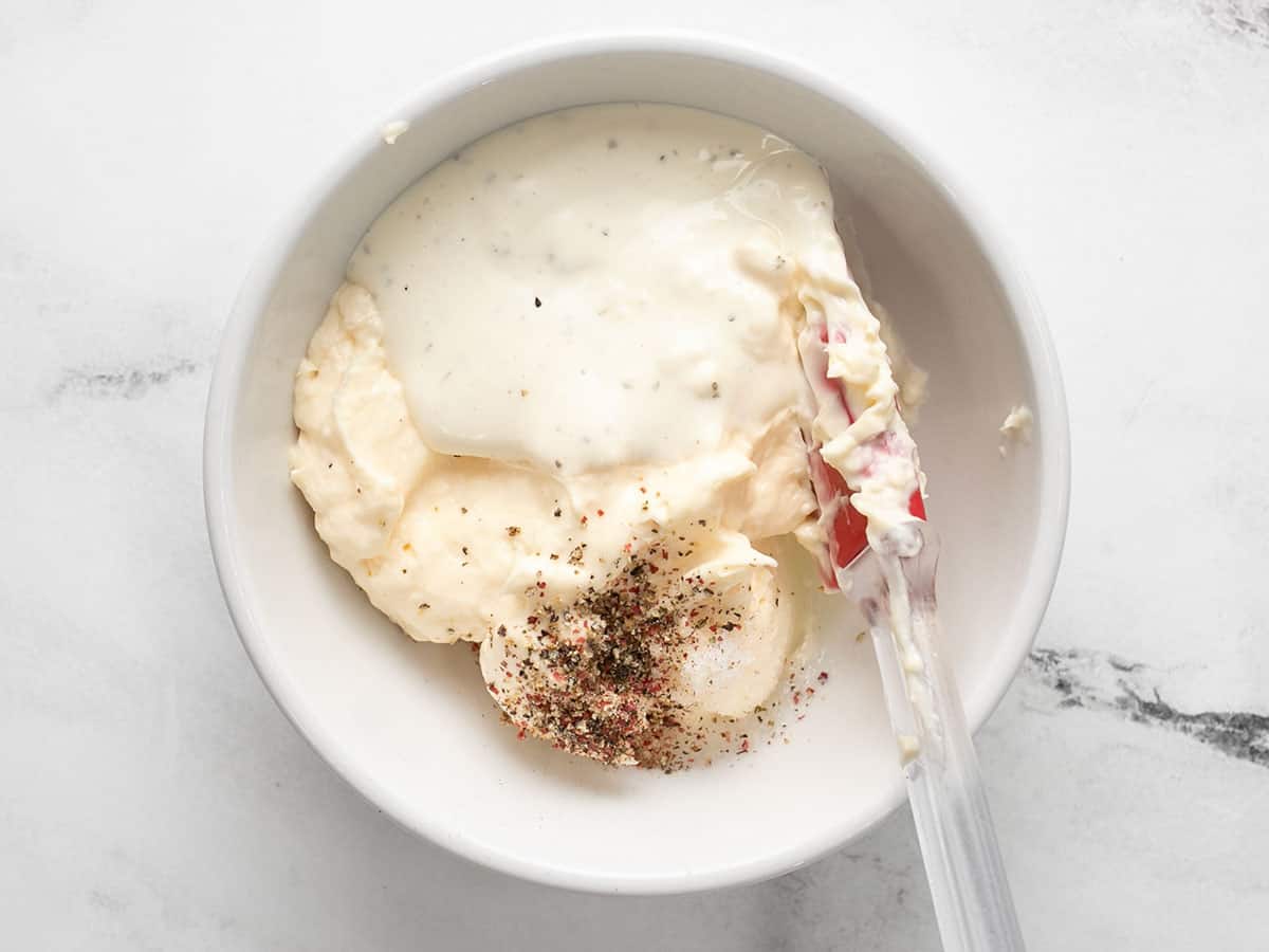 Dressing ingredients in a bowl, not stirred together.