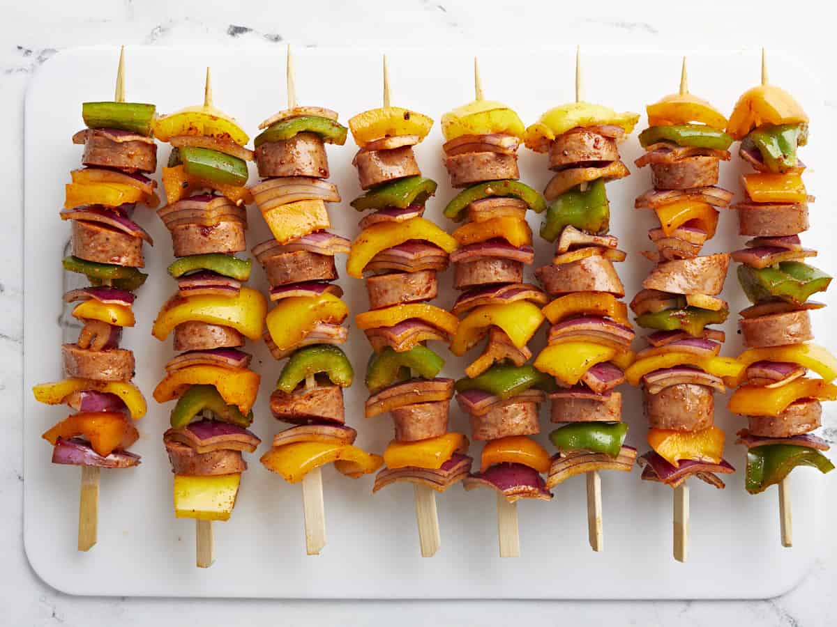 Prepared sausage kebabs on skewers, uncooked.