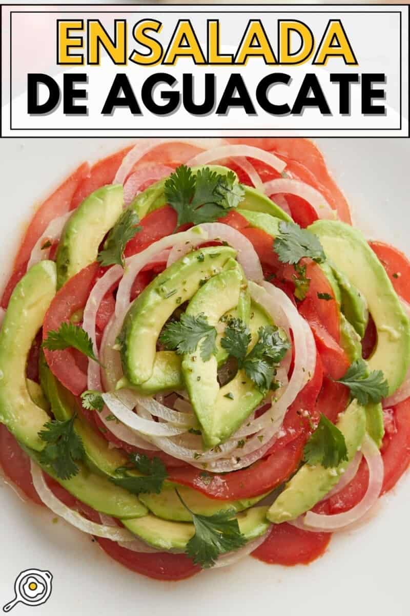 Overhead shot of Ensalada de Aguacate on a white plate.