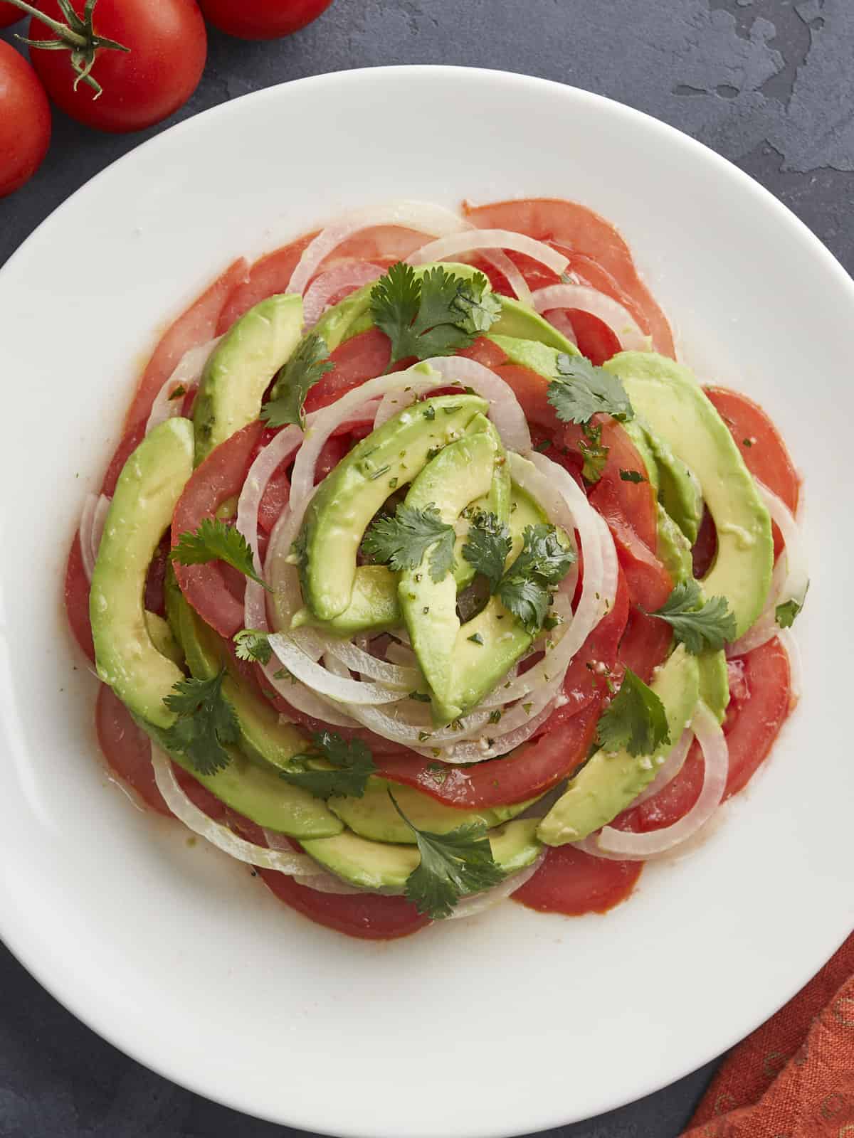 Overhead shot of Ensalada de Aguacate on a white plate.