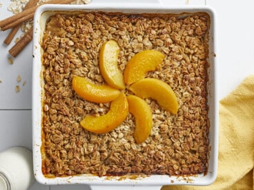 Overhead shot of Peach Baked Oatmeal in a white baking dish.