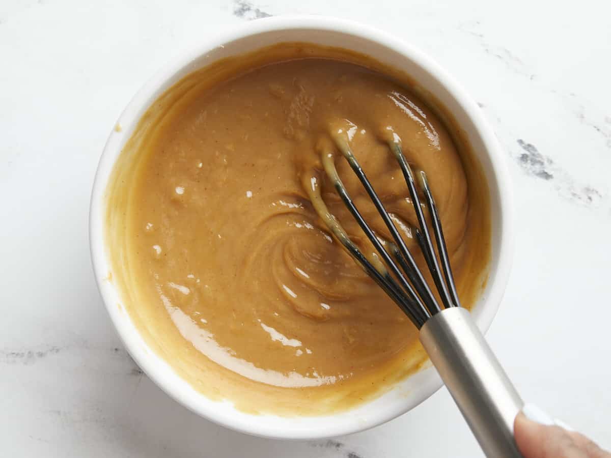 Overhead close up shot of peanut lime dressing.