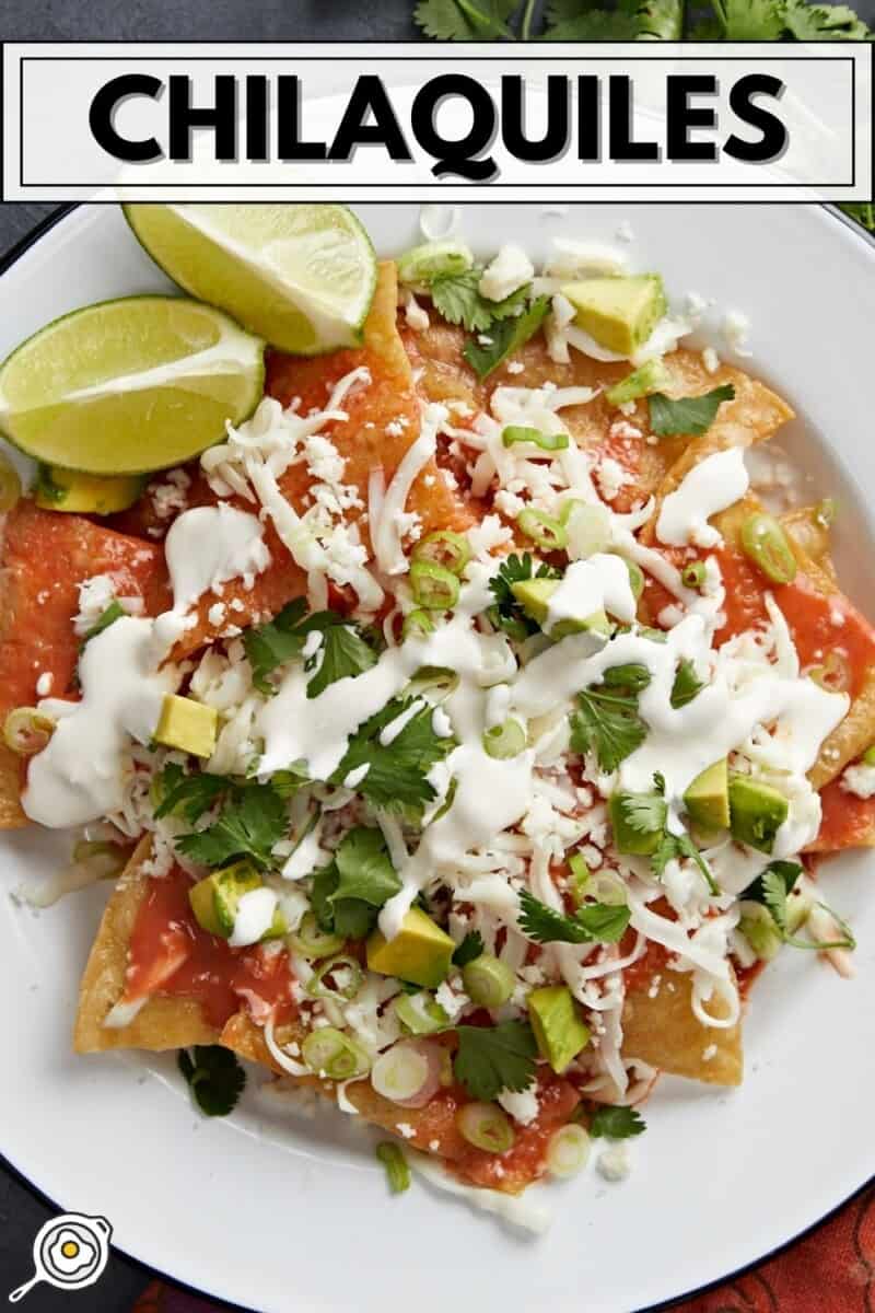 Overhead shot of chilaquiles served on a white plate.