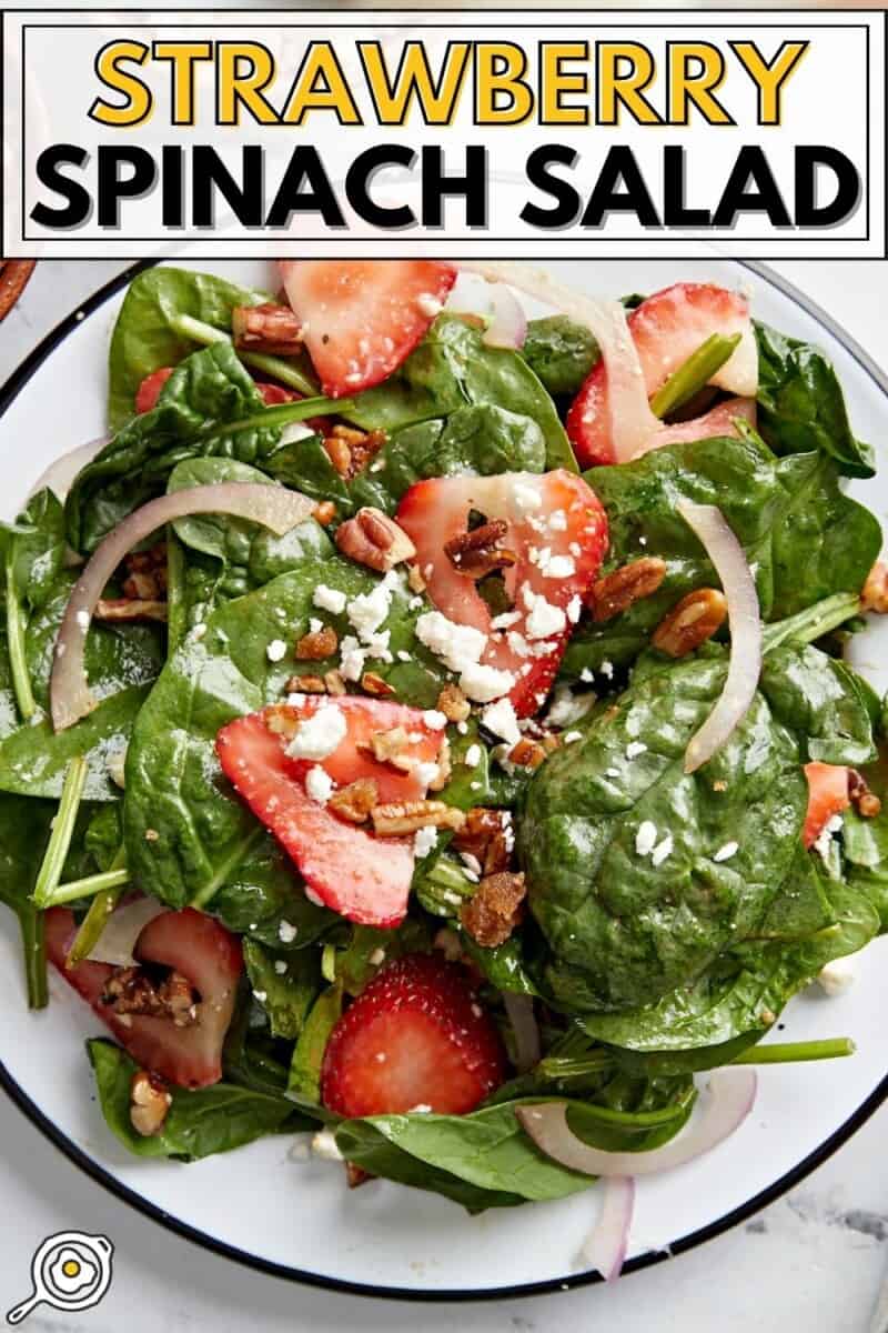 Close up overhead shot of plated strawberry spinach salad