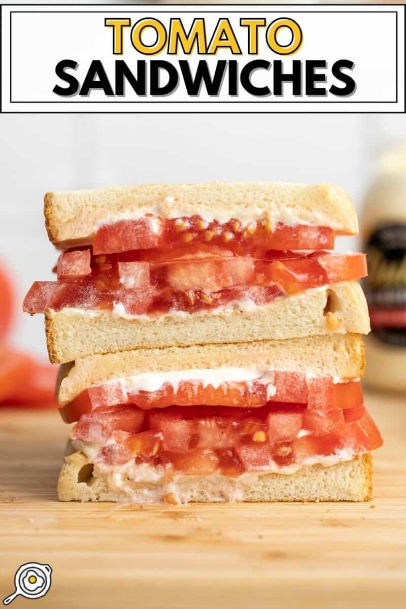 Side view of a sliced and stacked tomato sandwich.