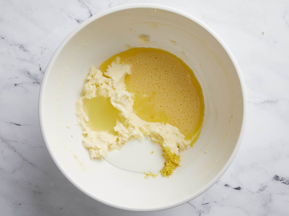 Wet ingredients for lemon pound cake in a bowl.