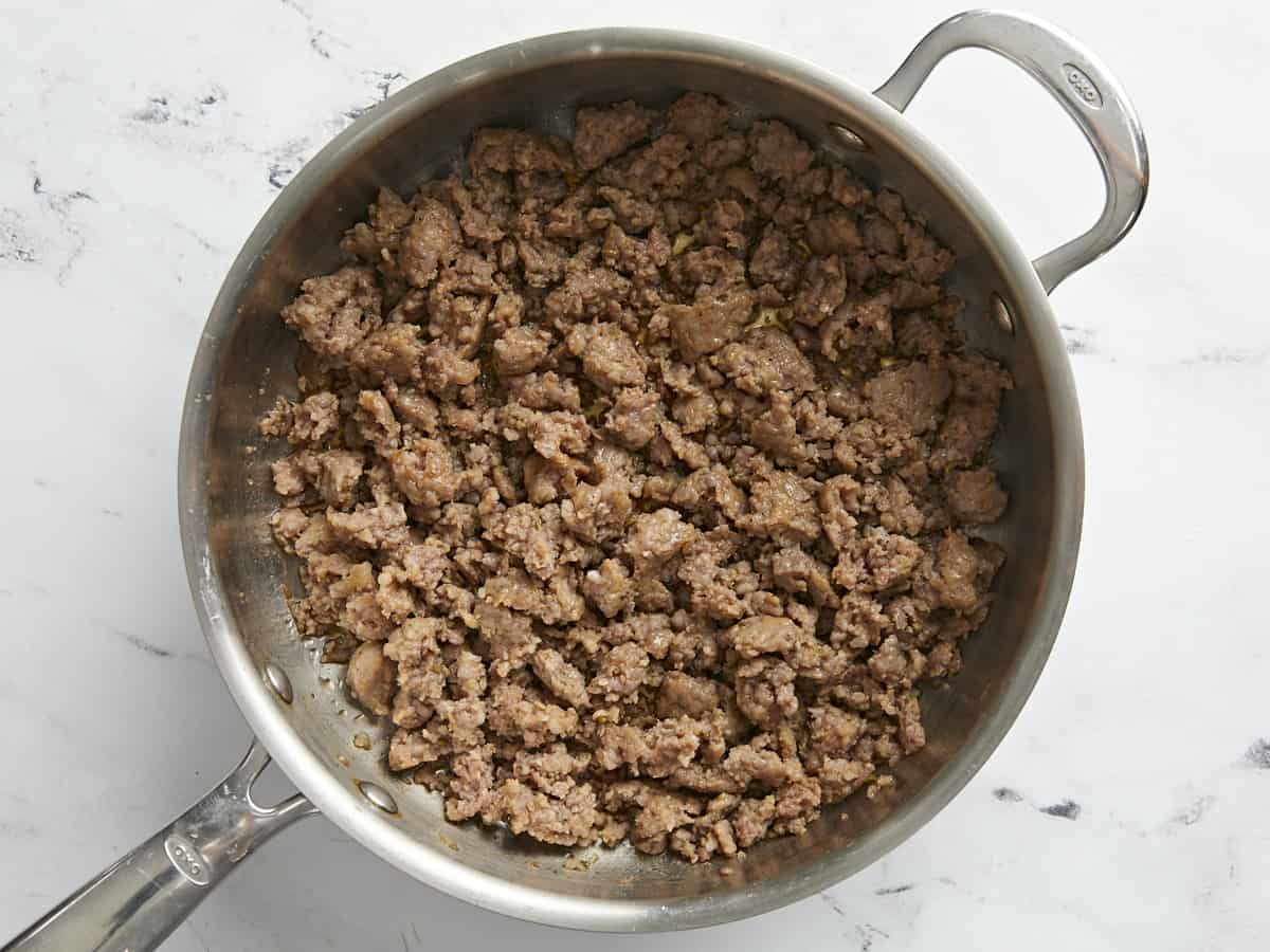 Cooked Italian sausage in a large skillet.