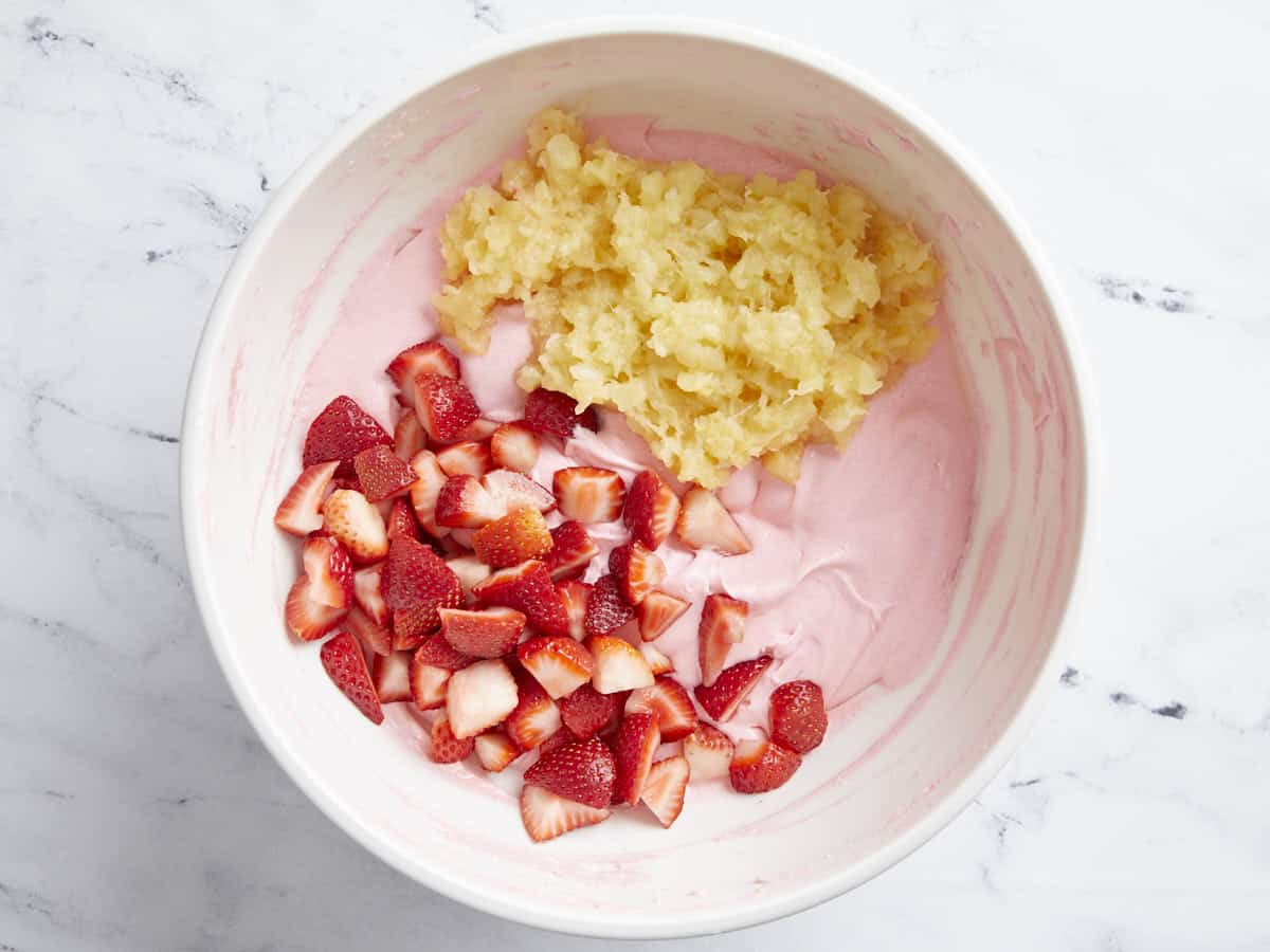 Chopped strawberries and crushed pineapple added to strawberry gelatin.