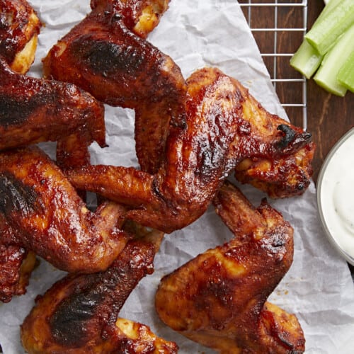 Overhead shot of finished BBQ Wings on a rack set over a sheet pan.